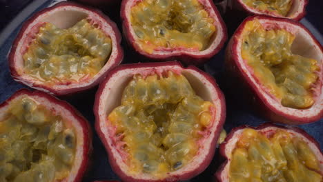 close up rotating passion fruits, juicy tropical maracuya, exotic fruits, 4k macro shot