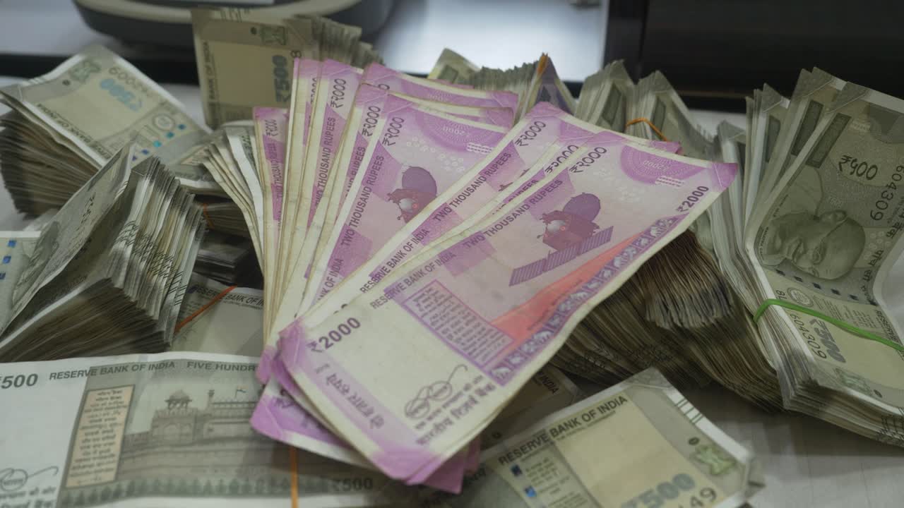 Stack of Indian Rupee Banknotes of different value, Indian Currency, Cash, 2000 and 500 Rupee Note, Closeup shot