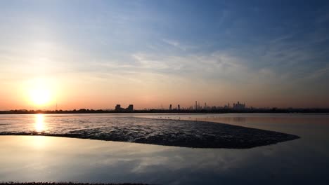 wide angle sunrise composed with water and nyc in the background, 4k resolution video.