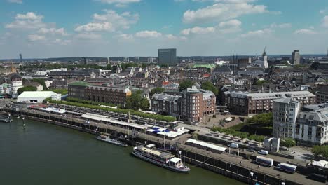 along the harbour side in düsseldorf residents and tourists walk