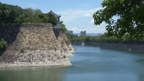 ishigaki stone walls with the corner sengan yagura turret on osaka castle in osaka, japan. static shot