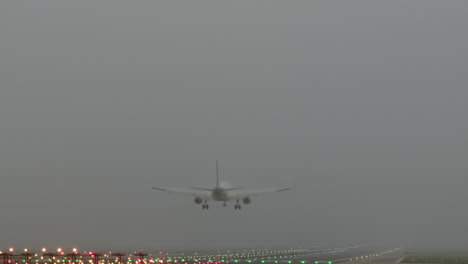 airplane landing in dense fog