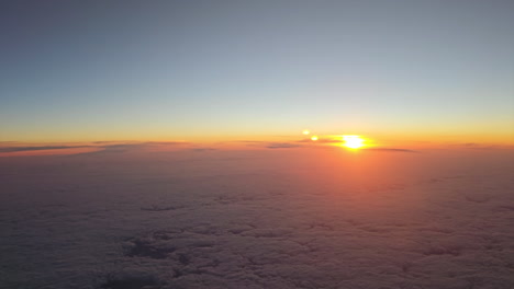 high angle view of beautiful golden sunset above clouds