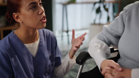 nurse and senior woman in conversation