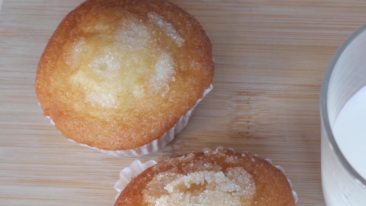 Close-up of sugar-topped muffins on a wooden board