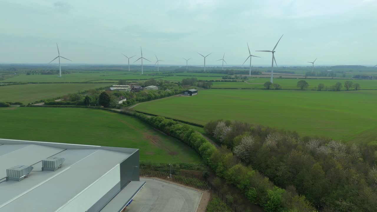 Aerial Drone View of Wind Turbine Power Station in Rural England's Green Fields