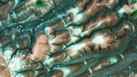 aerial : top view of dry land, brown and white soil in cheltenham badlands, ontario canada