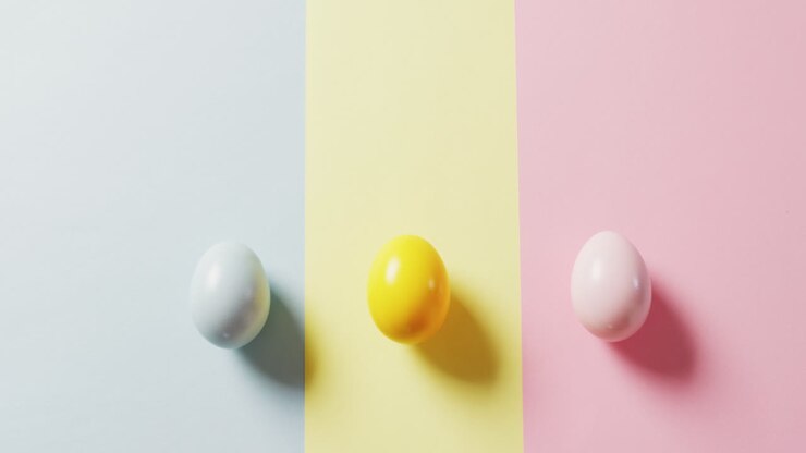 Close up of three colorful easter eggs on colorful background