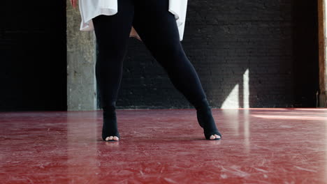 woman dancing indoors