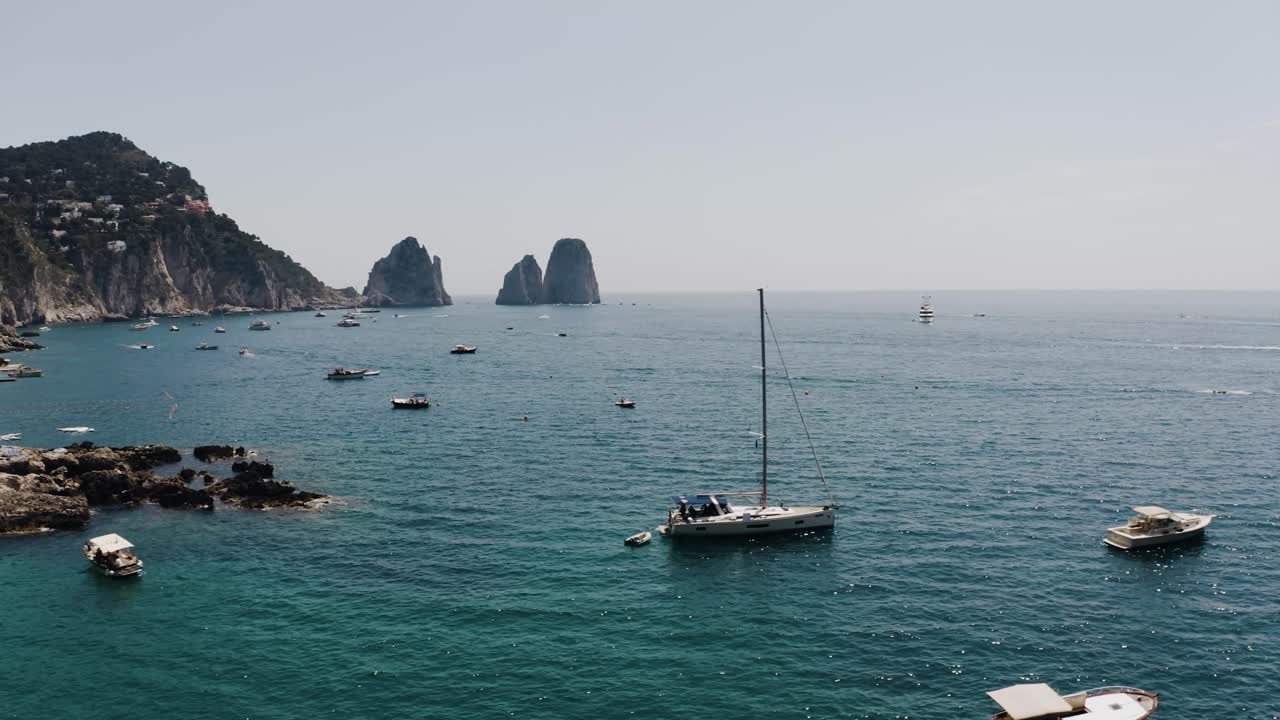 Drone shot of boats safely parked in Capri, Italy's calm waters