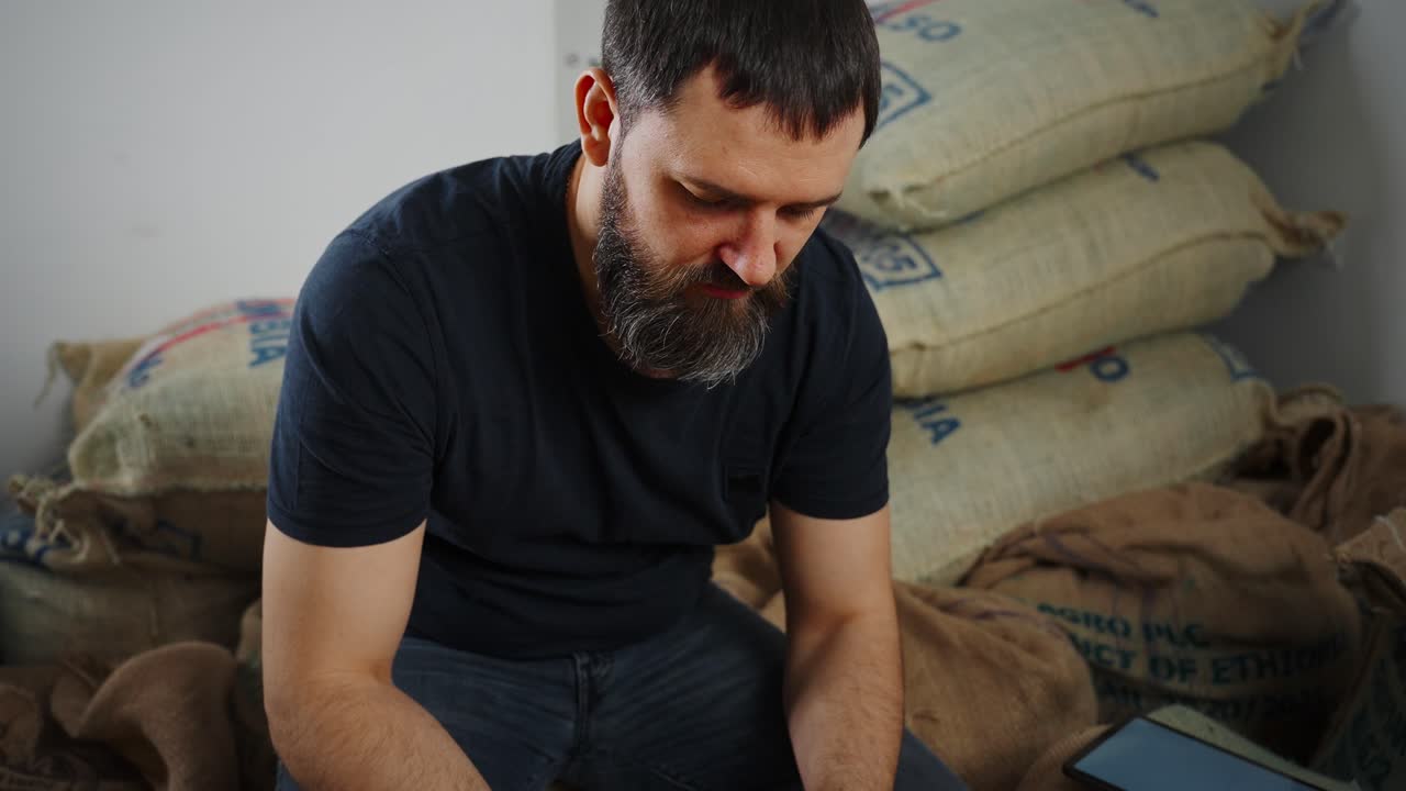 Coffee Farmer Inspecting Coffee Beans