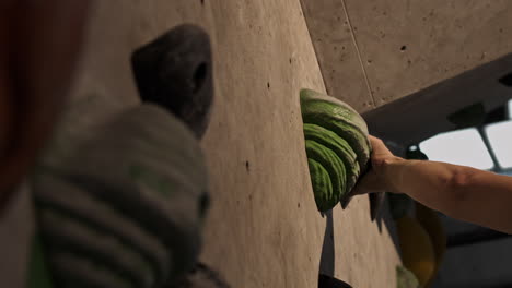 person climbing on a climbing wall