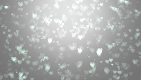 animation of white hearts on a gray background