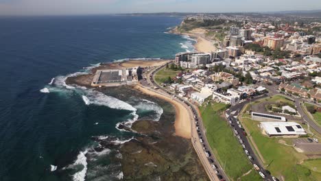 seascape and newcastle ocean baths in new south wales, australia - aerial drone shot