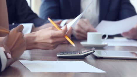 business partners coworkers working discussing together in boardroom, brainstorming, discussing, report, analyzing and planning market strategy doing paperwork analysis in office