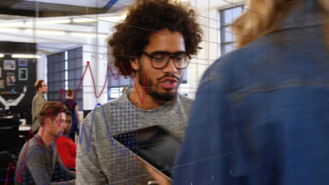 animation of data processing and diagrams over diverse business people discussing work