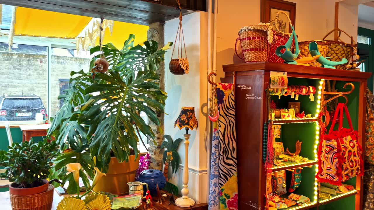 Colorful artisan gift shop interior in Cancale, France, filled with handmade decor, fashion accessories, and warm boutique lighting in an inviting retail setting