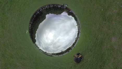 spherical timelapse of city street view with green grass around