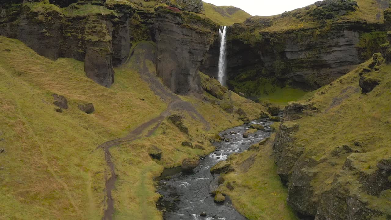 Reveal drone shot of Kvernufoss Waterfall in Autumn, Iceland