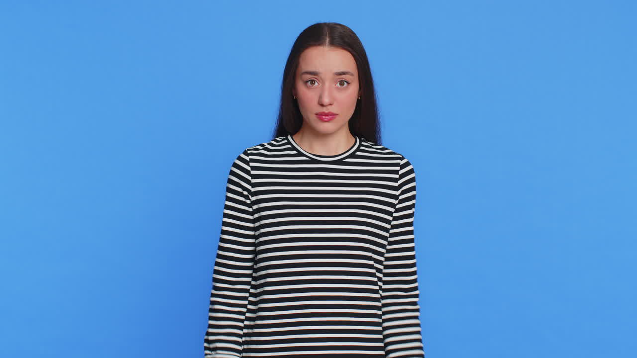 Caucasian woman in striped blouse pointing fingers herself feels innocent not her fault fail mistake