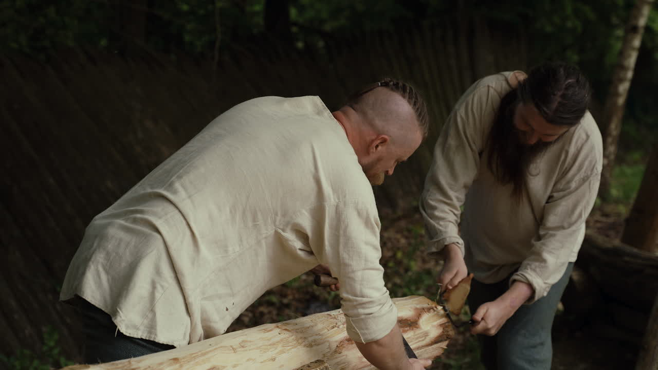 Medieval Men Working with a Saw