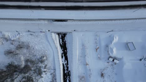 aerial over snow covered highway in town of omu in hokkaido