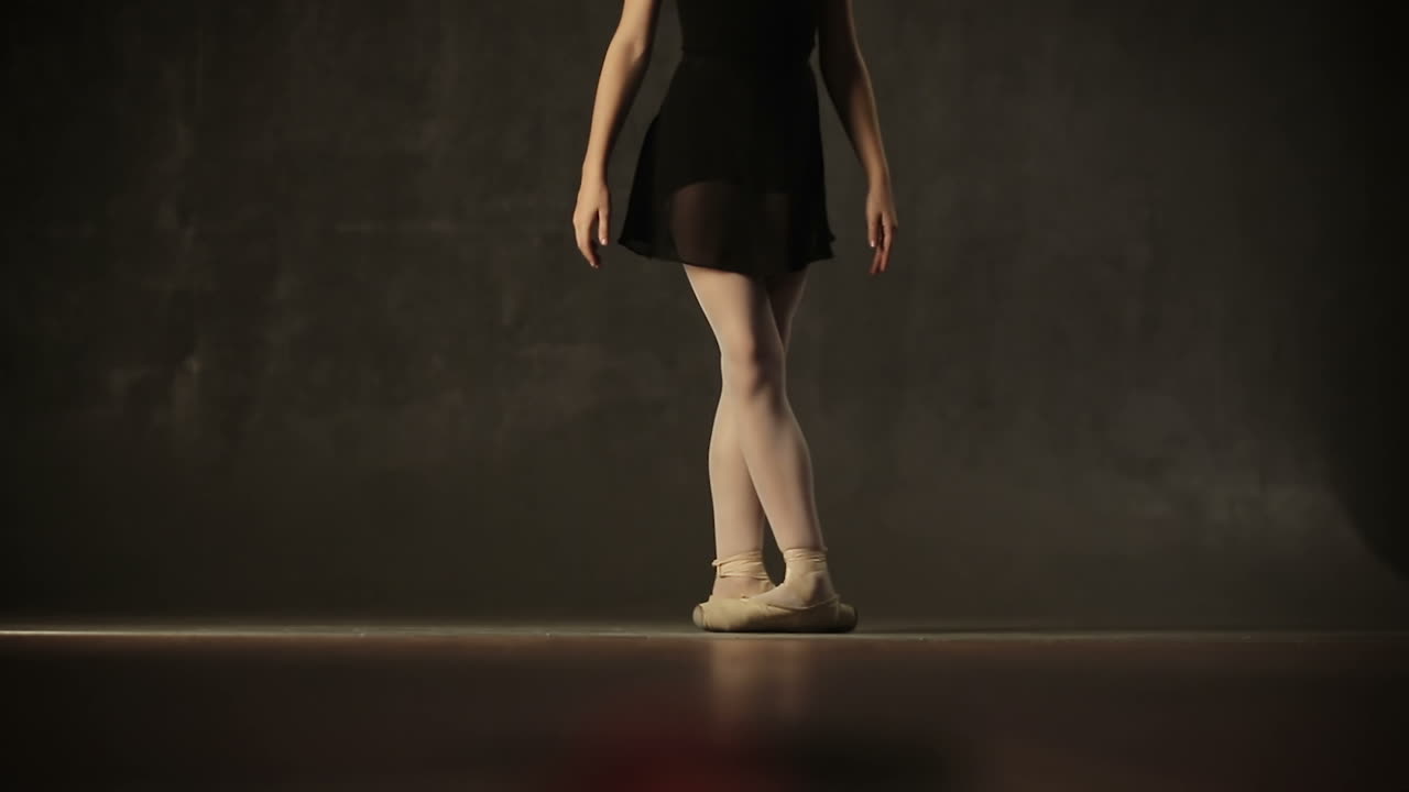Pretty young ballerina wearing a tutu in a dance studio