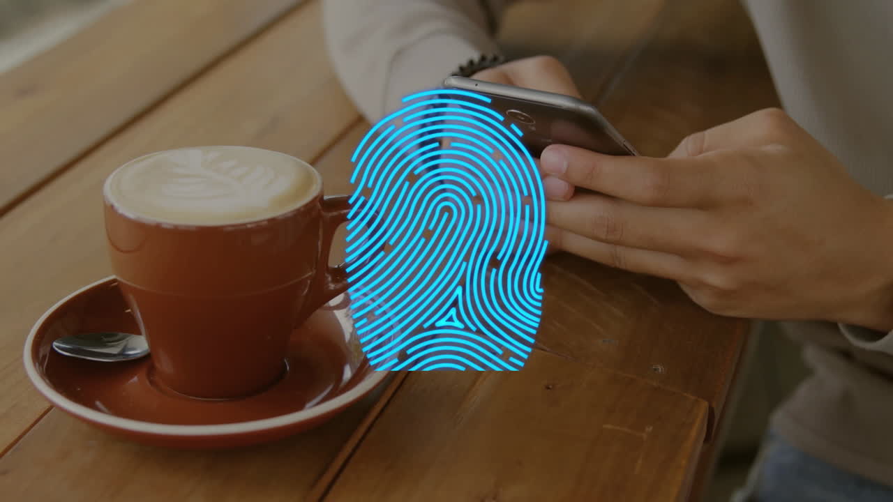 man holding smartphone over wooden cafe table, showing animated marketing charts above latte art