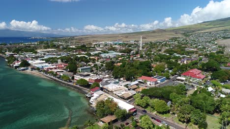 cinematic aerial shot of the historic front street in lahaina, maui, prior to being burned down in the 2023 maui wildfires