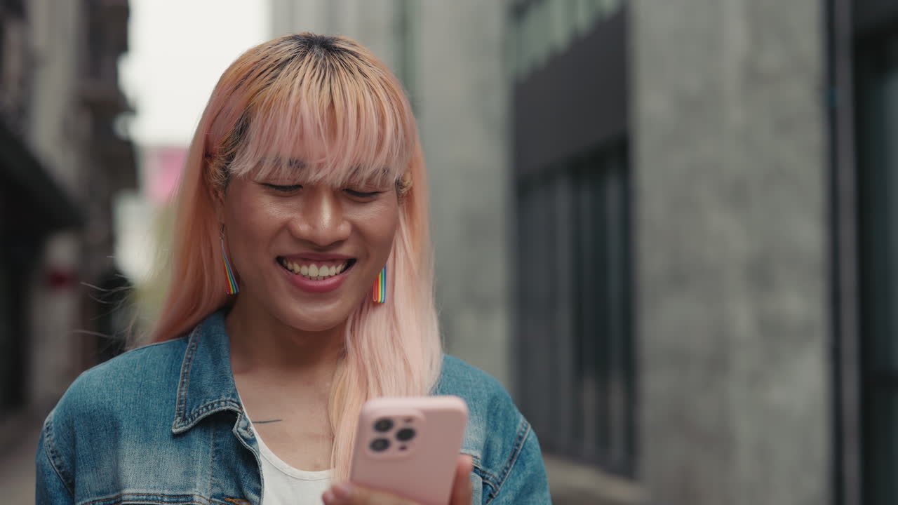 Smiling Person using Phone Outdoors