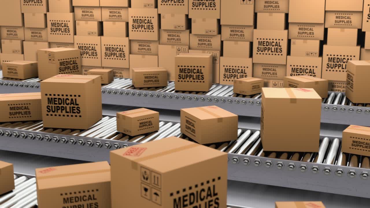 Cardboard boxes with medical supplies and donations on the conveyor belt