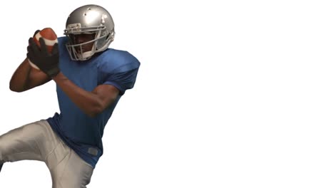 american football player catching ball
