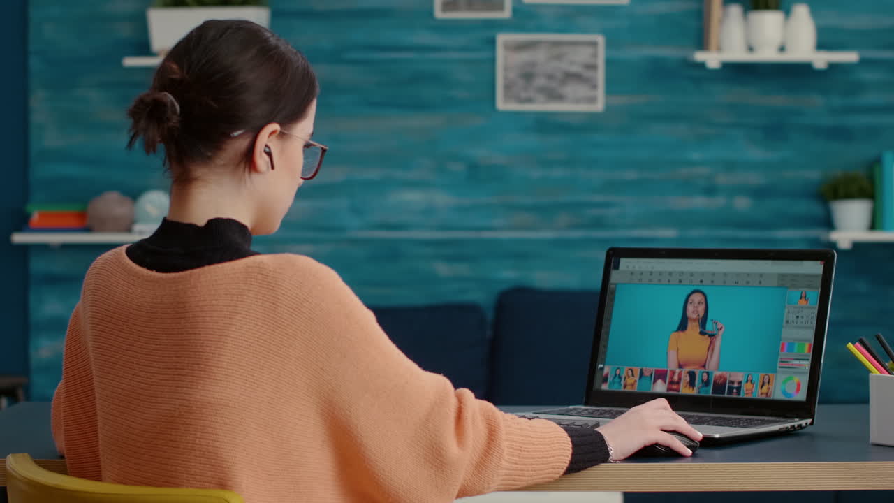Graphic designer retouching picture for online editing class
