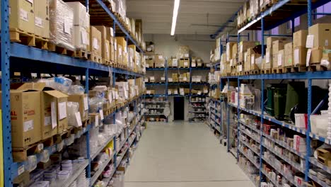 slow jib shot moving down of a food, grocery and households warehouse in italy