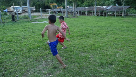 two boys playing soccer