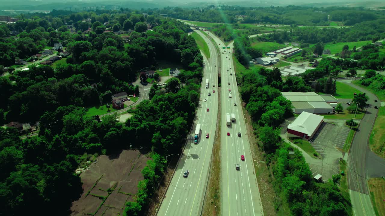 Turquoise blue semi truck with reefer trailer on I-70 in Wachington city from Pennsylvania, USA.