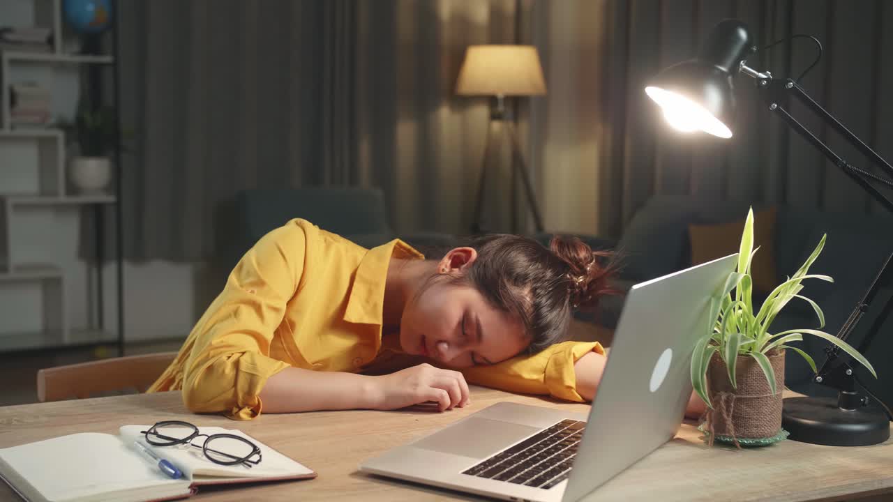 Asia Girl Sleeping While Working From Home At Living Room At Night
