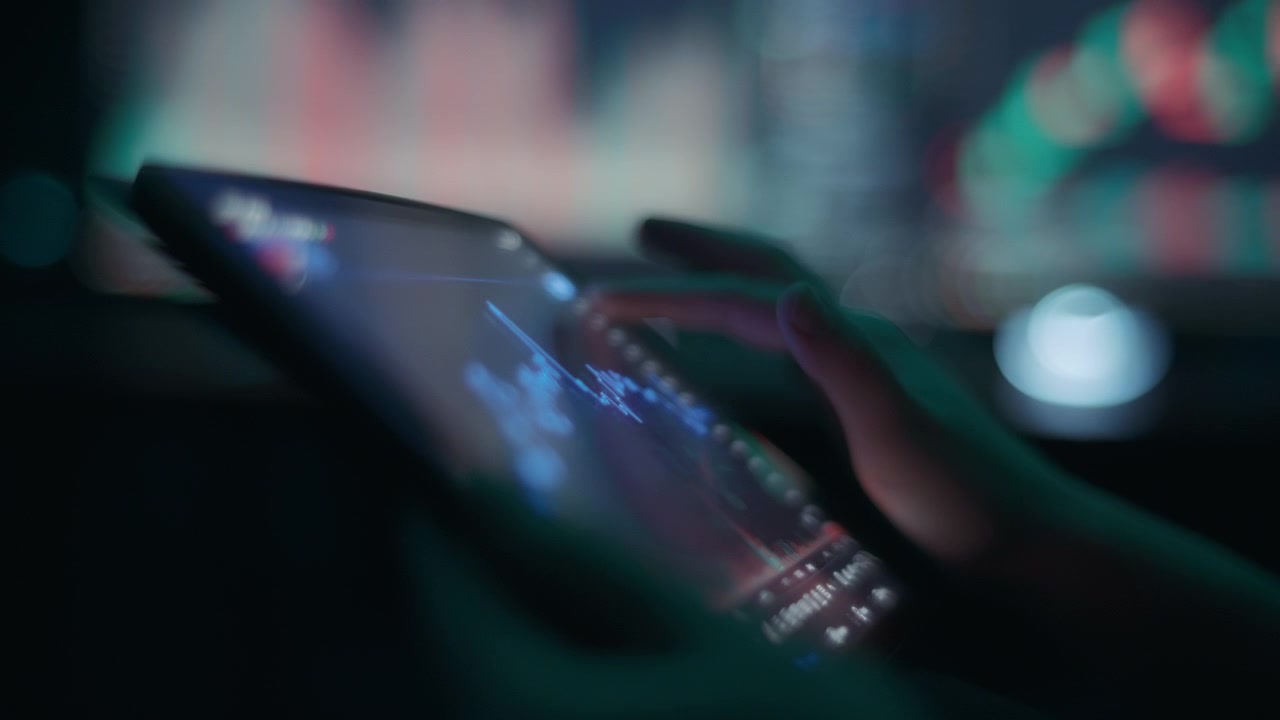 Stock trader analyzing stock exchange market graph using a tablet app