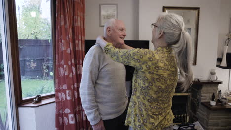 elderly couple interacting at home