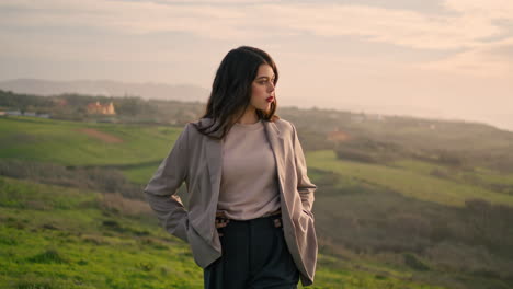 gorgeous woman walking hill closeup. attractive girl looking on cloudy scenery.