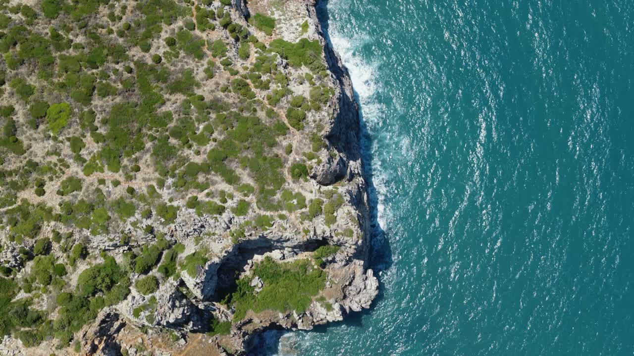 Topdown View Of Rocky Sea Cliffs At Sardinia, Italy. Aerial Shot