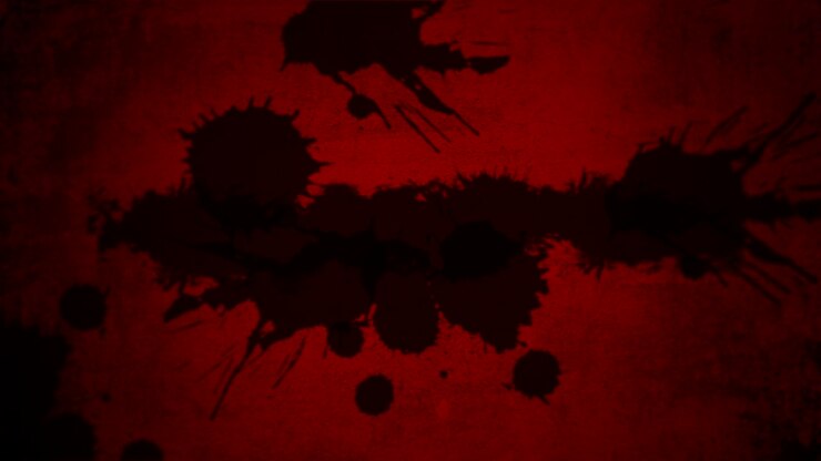 éclaboussures de peinture noire sur dégradé rouge foncé