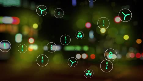 animation of multiple digital icons against blurred view of night city traffic