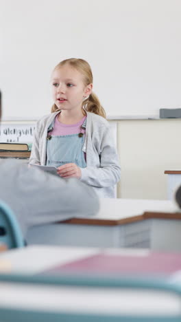 young girl presenting in classroom