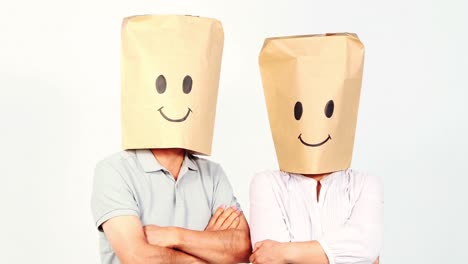 couple with paper bags on the head