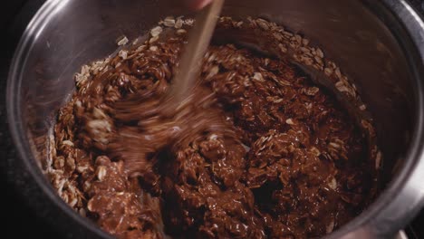 hand stirring the batter for a delicious cake, baking chocolate oat cake - steady shot