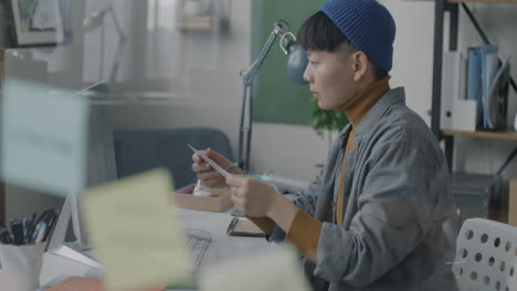 young woman reading documents in a modern office