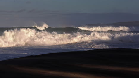 Waves-roll-into-a-beach-following-a-big-storm-in-slow-motion-5