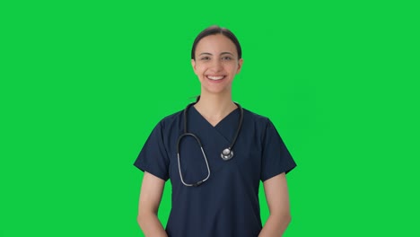 Happy-Indian-female-doctor-getting-ready-for-work-Green-screen