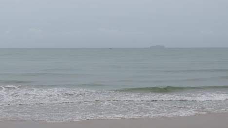 rayong beach while rain and strong waves in the rainy season. cloudy rainy weather with strong wind